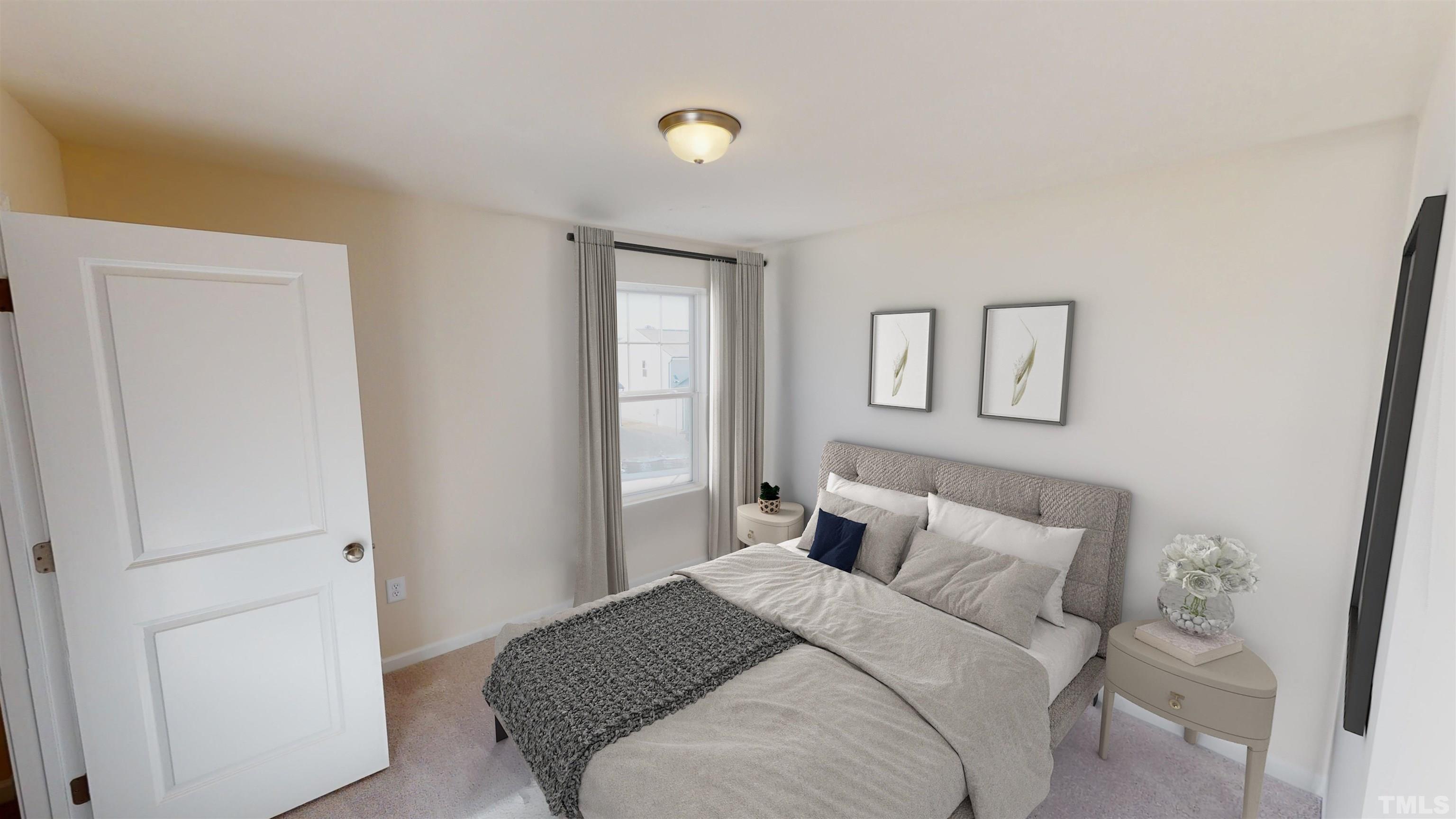 3429 Dragonfly River Raleigh, NC 27604 - Photo 19 of 27 a bedroom with a bed and a window