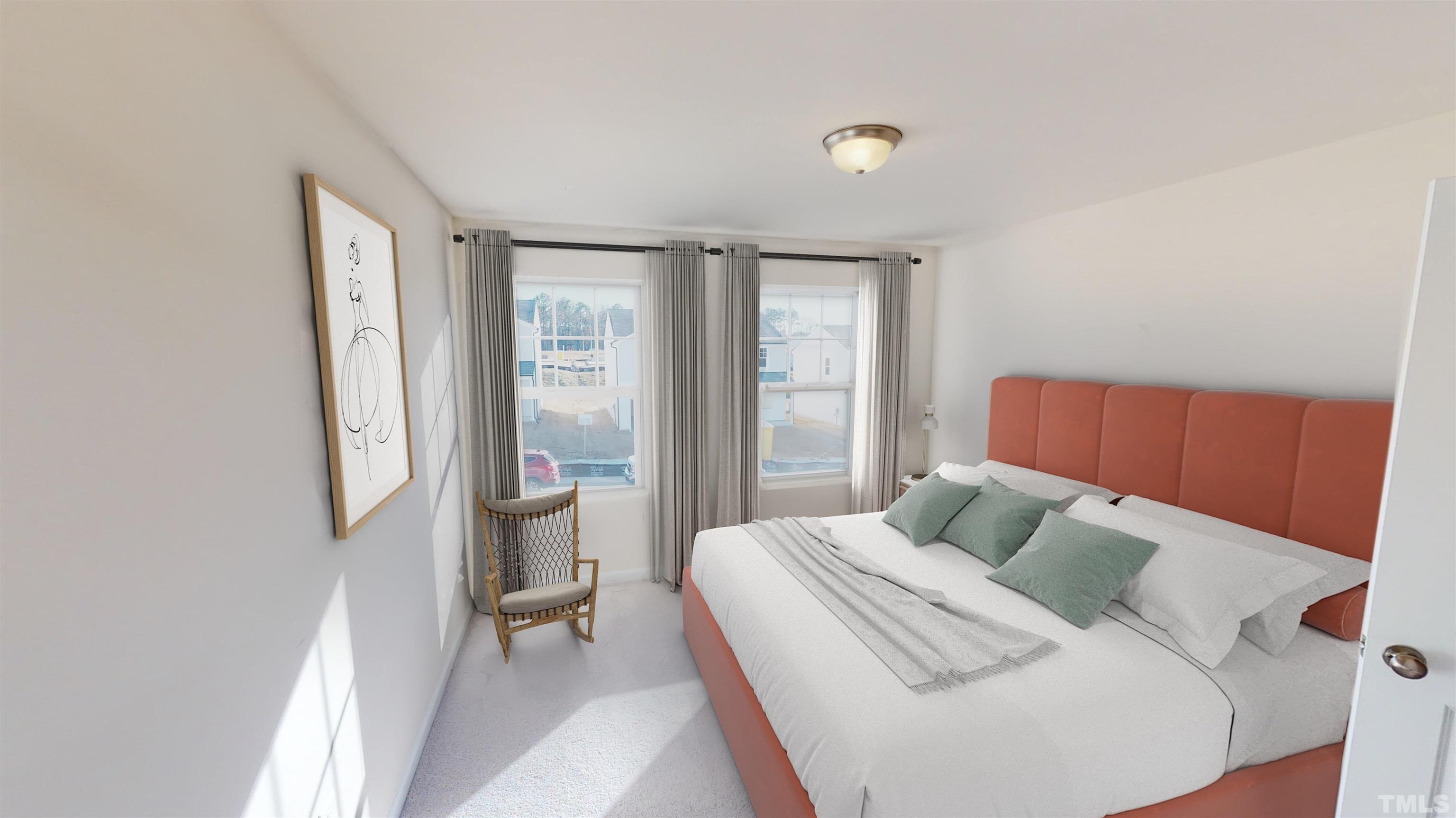 3429 Dragonfly River Raleigh, NC 27604 - Photo 21 of 27 a bedroom with a bed and wooden floor