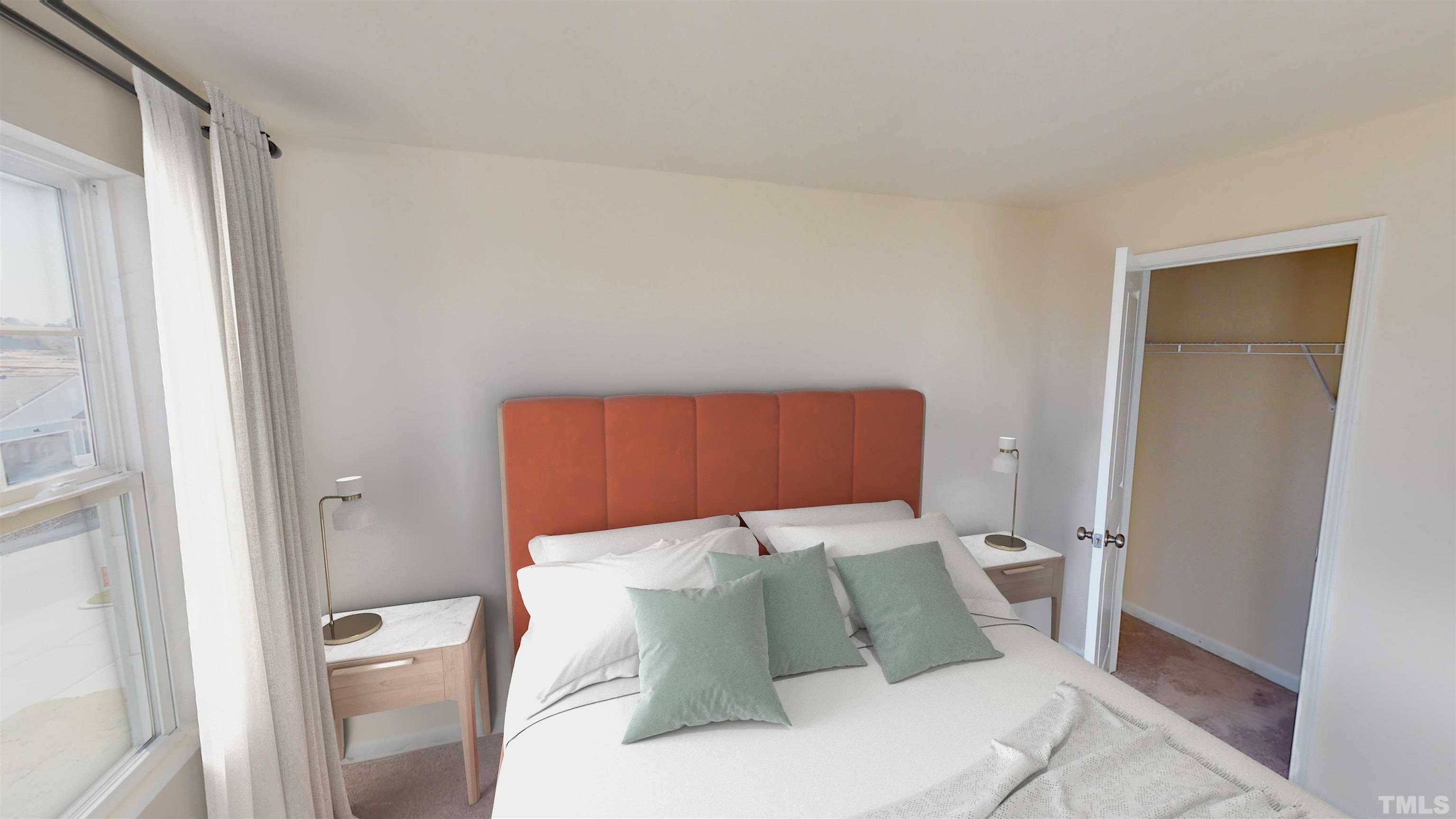 3429 Dragonfly River Raleigh, NC 27604 - Photo 22 of 27 a bed sitting in a bedroom next to a bathroom