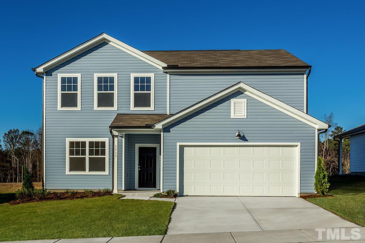 3429 Dragonfly River Raleigh, NC 27604 - Photo 8 of 27 a front view of a house with a garden