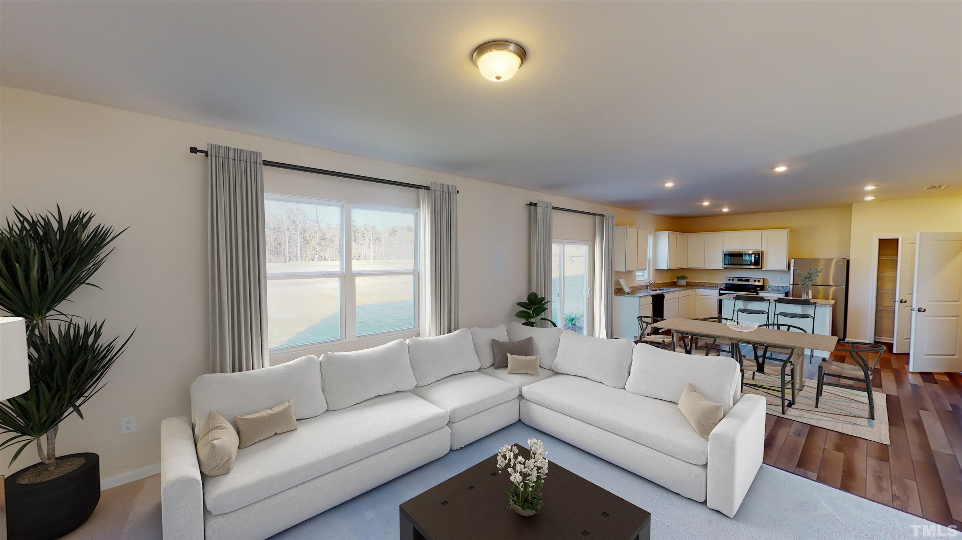 3429 Dragonfly River Raleigh, NC 27604 - Photo 10 of 27 a living room with furniture and a large window