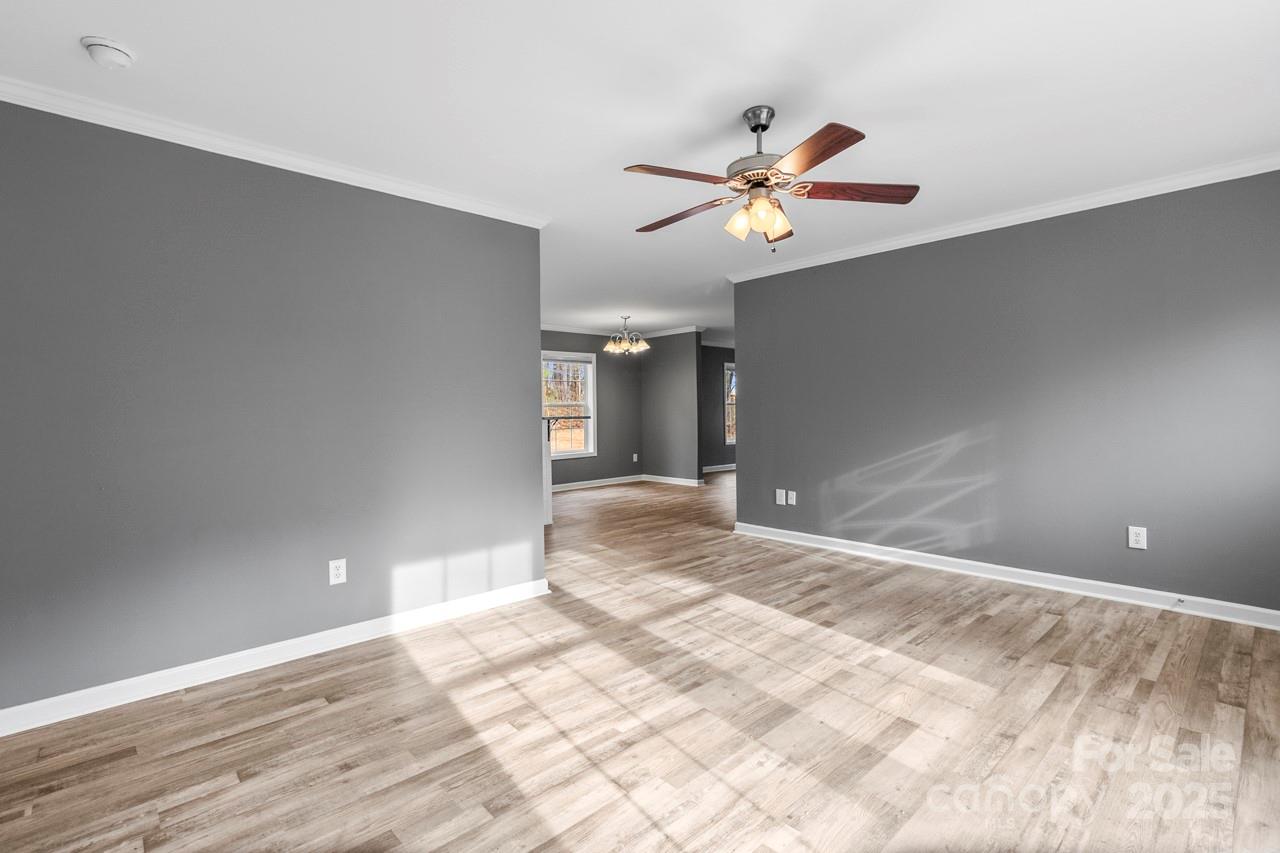 6706 Lineberger Road Denver, NC 28037 - Photo 17 of 34 a view of an empty room with window and wooden floor