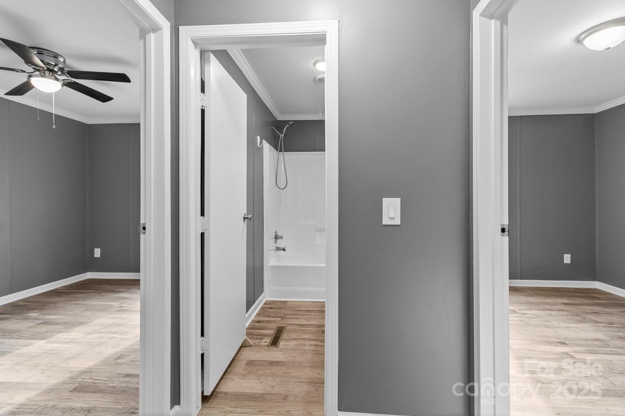6706 Lineberger Road Denver, NC 28037 - Photo 23 of 34 a view of a hallway with wooden floor and staircase