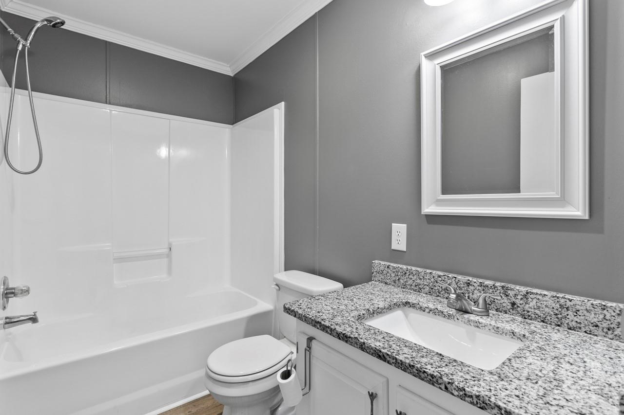 6706 Lineberger Road Denver, NC 28037 - Photo 24 of 34 a bathroom with a granite countertop sink toilet and shower