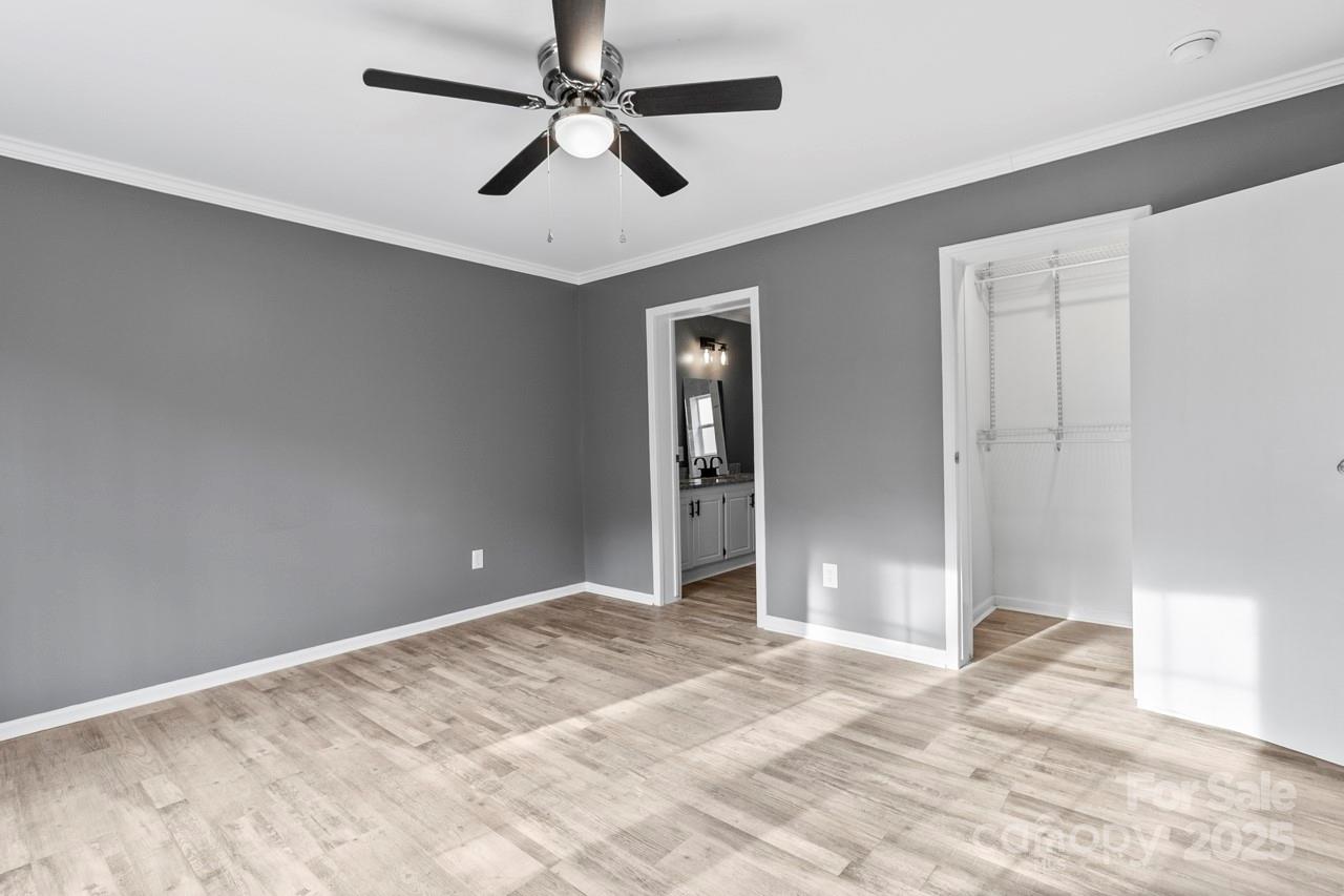6706 Lineberger Road Denver, NC 28037 - Photo 26 of 34 a view of a big room with wooden floor and windows in a room