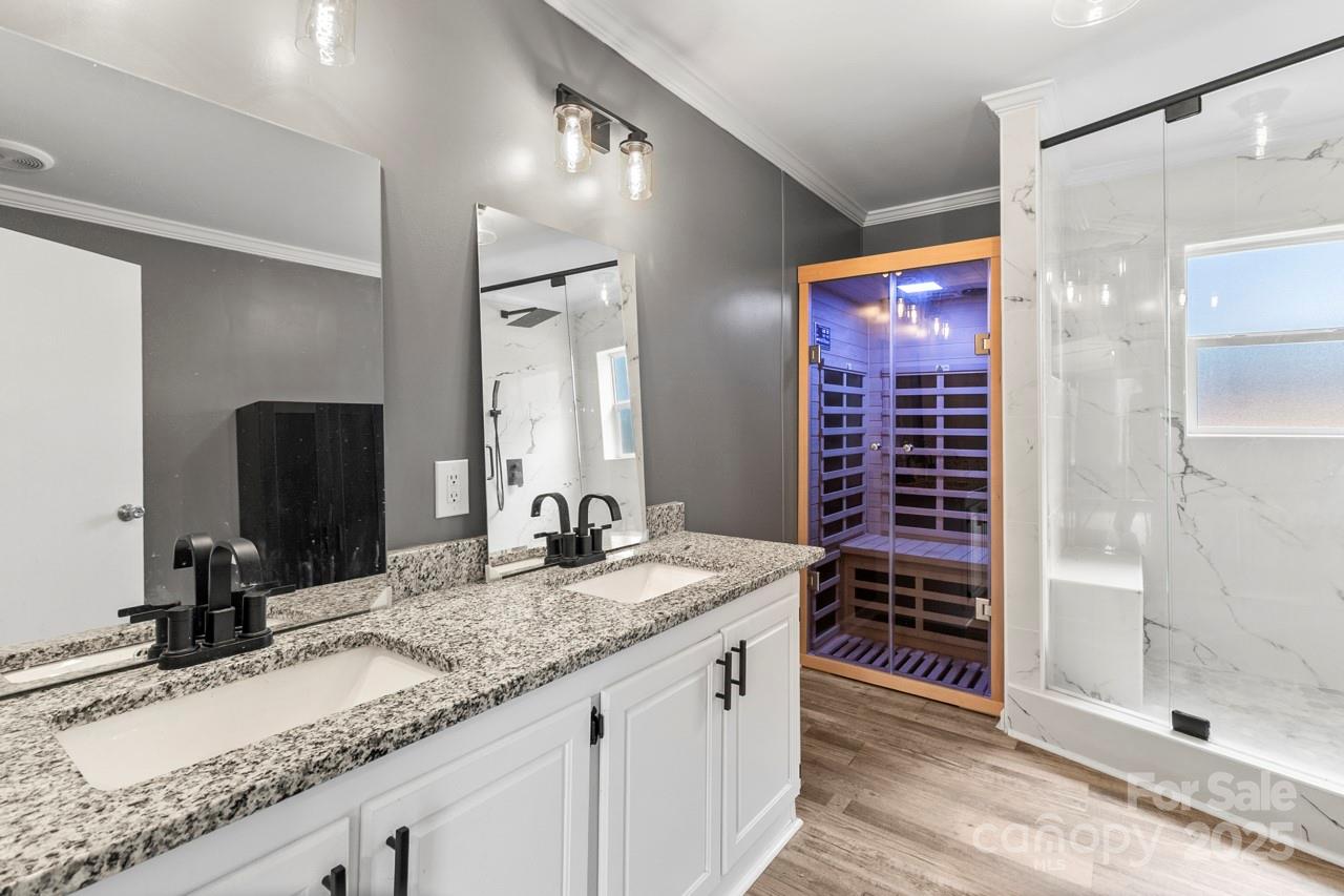 6706 Lineberger Road Denver, NC 28037 - Photo 3 of 34 a bathroom with a granite countertop sink and a mirror
