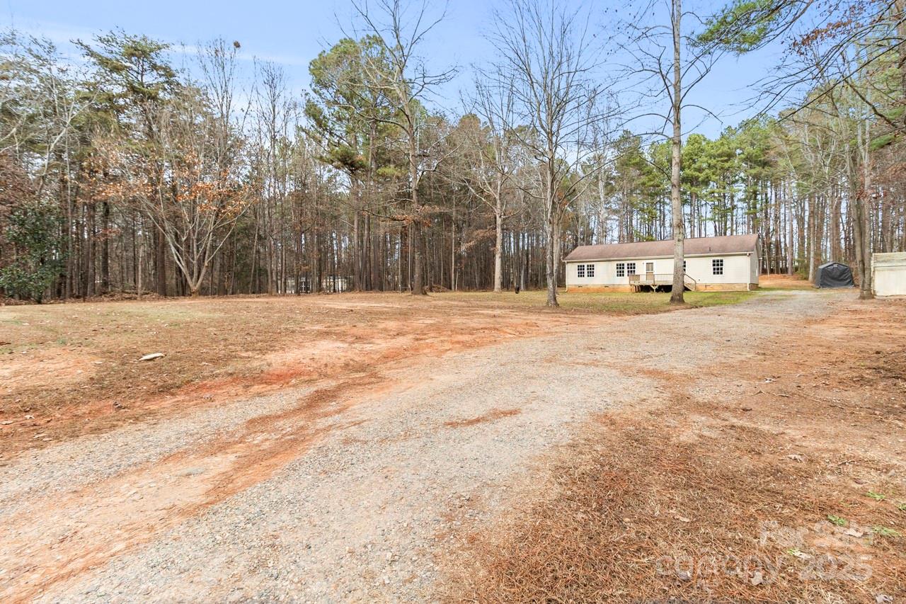 6706 Lineberger Road Denver, NC 28037 - Photo 6 of 34 a view of a yard with trees