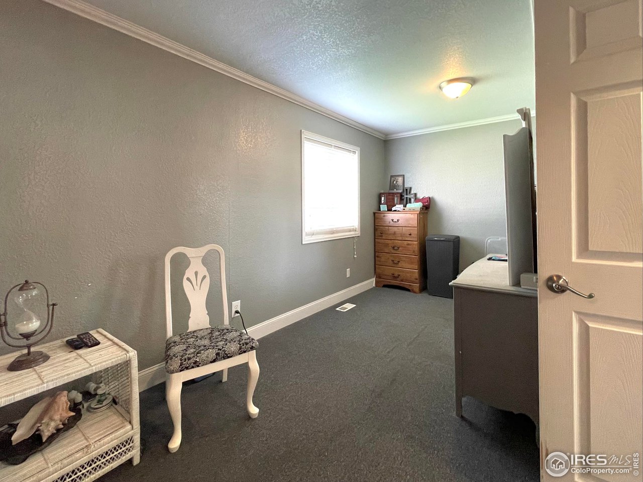 421 East 28th St Road Greeley, CO 80631 - Photo 13 of 30 Additional sitting area in primary suite with huge walk-in closet!
