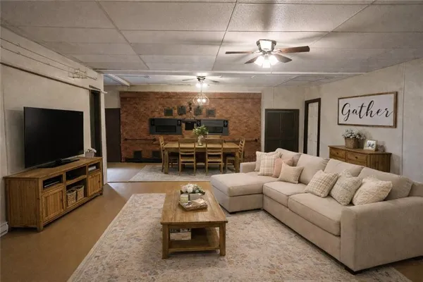 a living room with furniture and a flat screen tv