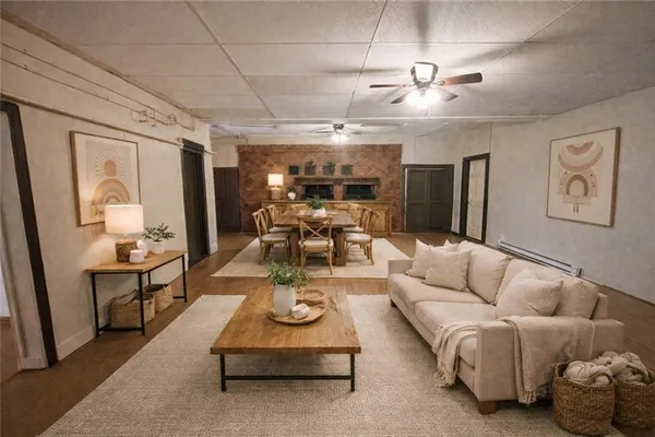 a living room with furniture and a chandelier