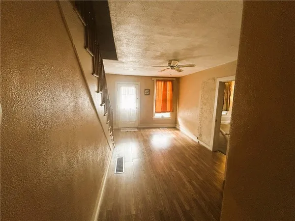 a view of entryway with wooden floor