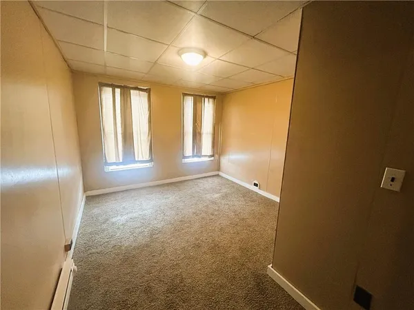 an empty room with windows