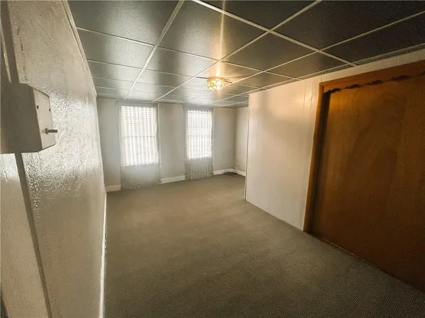 a view of empty room with windows