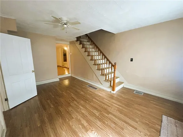 a view of an entryway with wooden floor