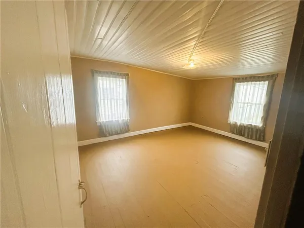 an empty room with windows