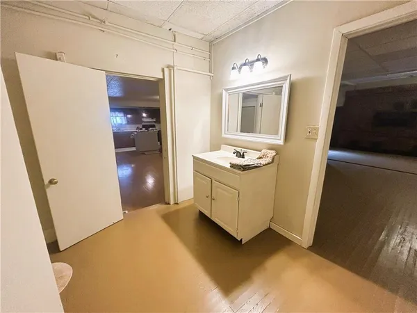 a bathroom with a sink a washer and dryer