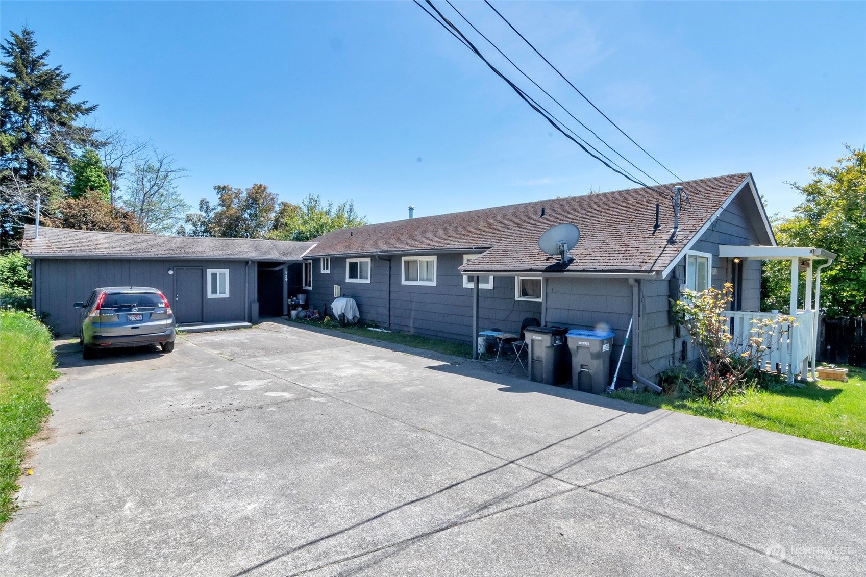 139 Oak Street Bremerton, WA 98310 - Photo 1 of 28 a front view of a house with a yard and garage
