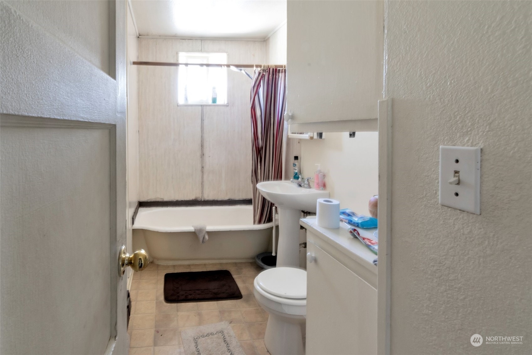 139 Oak Street Bremerton, WA 98310 - Photo 14 of 28 a white toilet sitting next to a bathroom sink