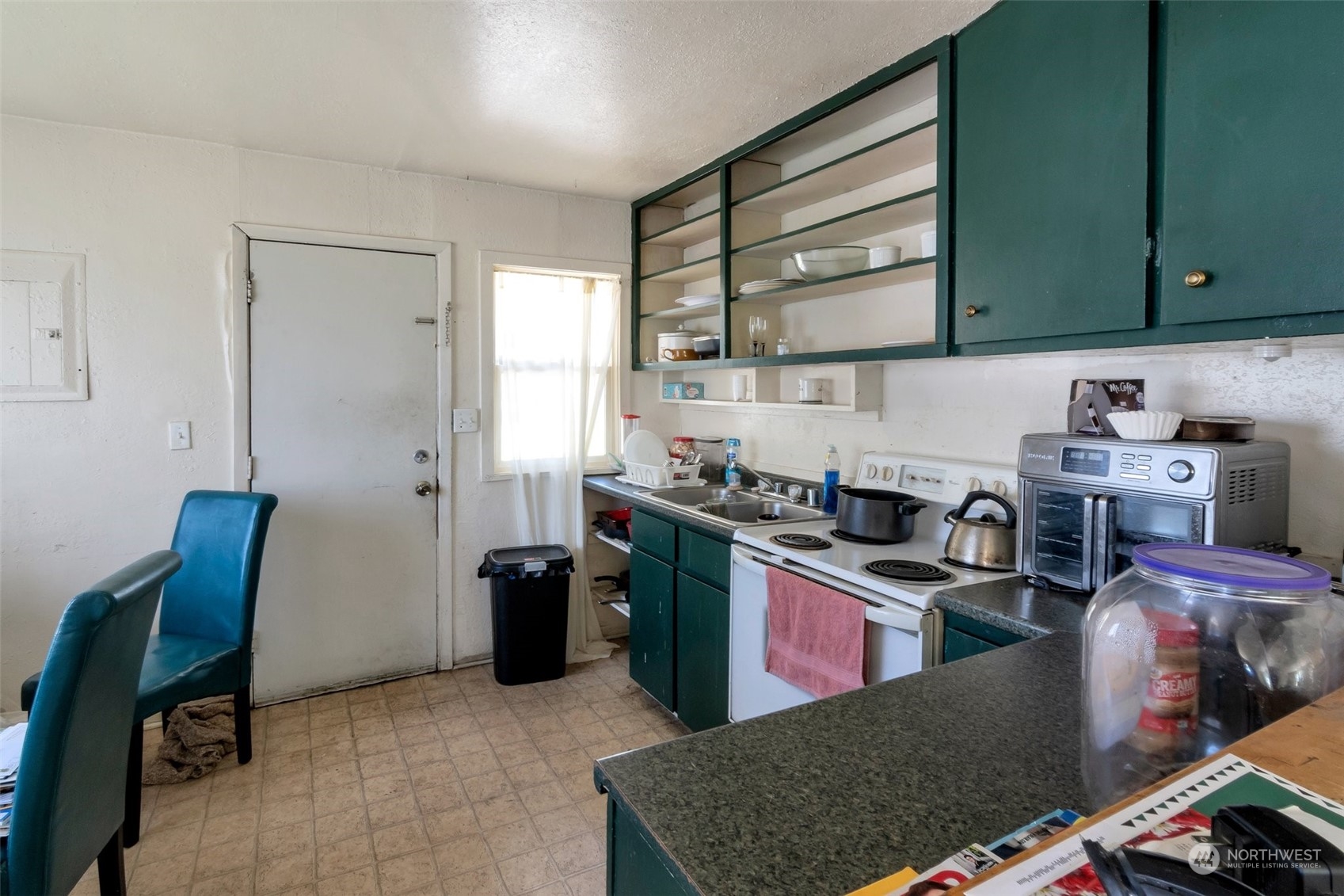 139 Oak Street Bremerton, WA 98310 - Photo 3 of 28 a kitchen with stainless steel appliances granite countertop a sink stove and refrigerator