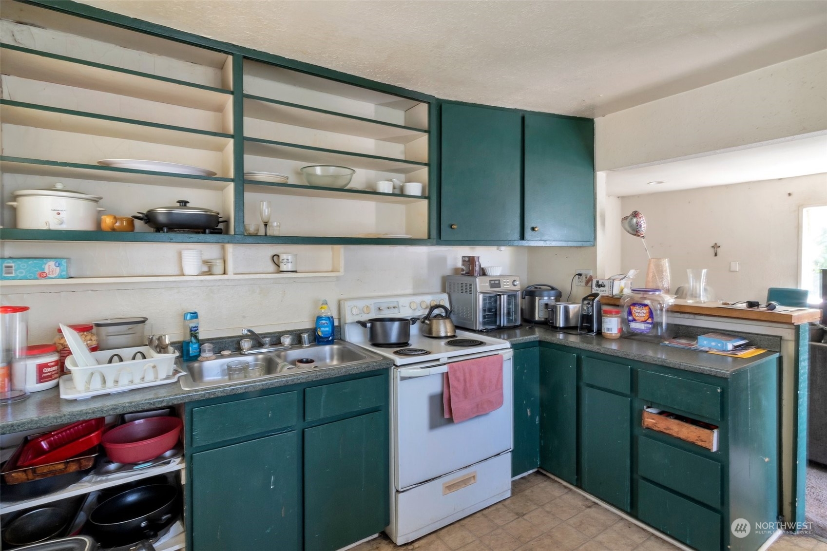 139 Oak Street Bremerton, WA 98310 - Photo 4 of 28 a kitchen with a sink dishwasher and cabinets with wooden floor