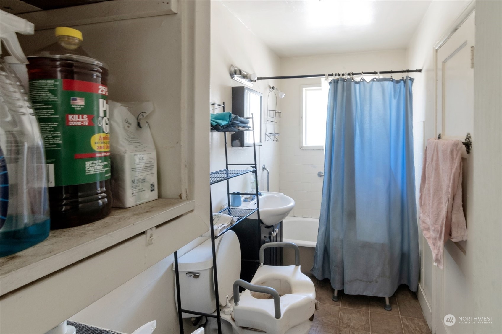 139 Oak Street Bremerton, WA 98310 - Photo 8 of 28 a bathroom with a shower curtain and a mirror