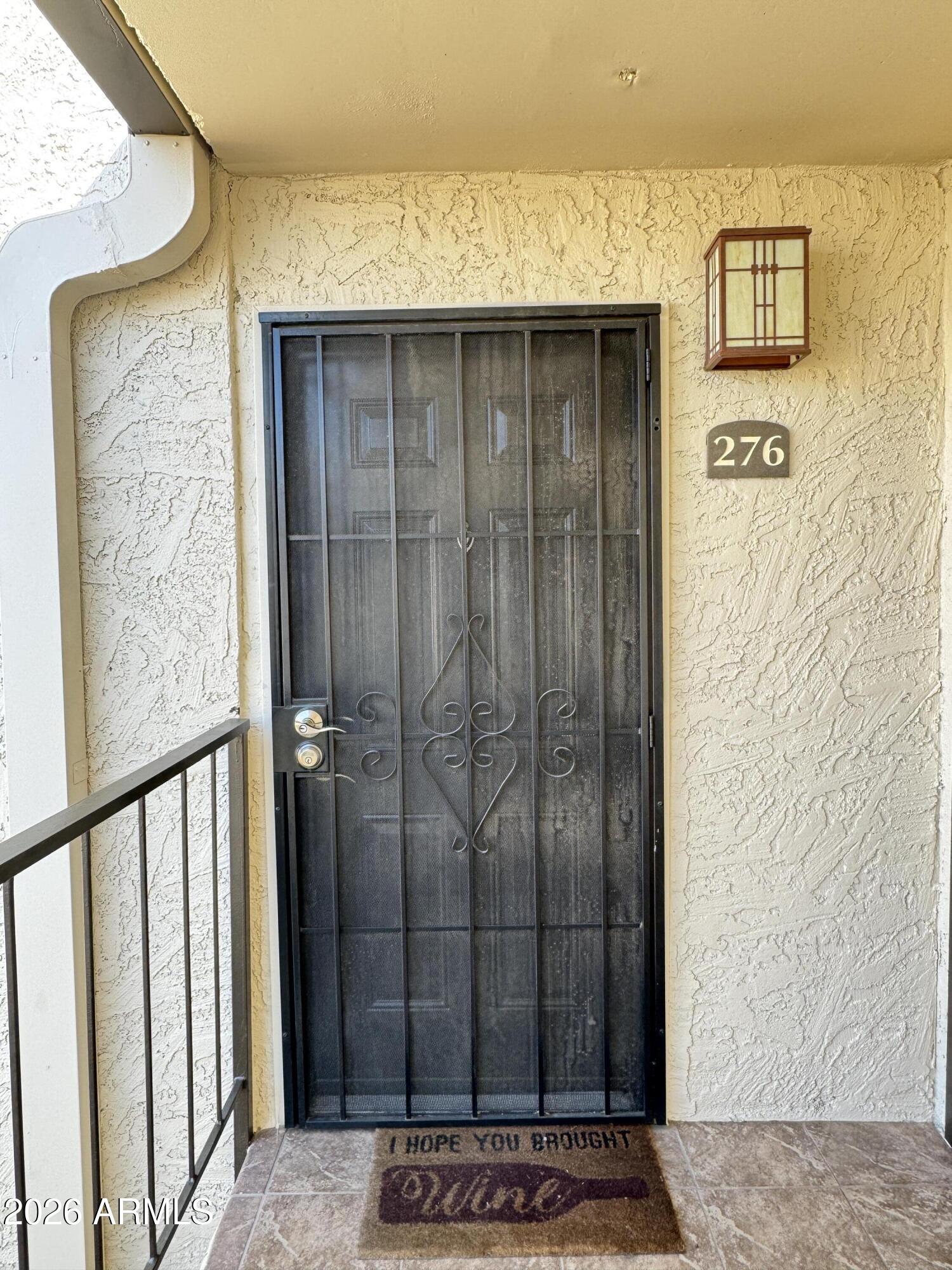 3825 East Camelback Road, Unit 276 Phoenix, AZ 85018 - Photo 11 of 12 a view of a wooden door