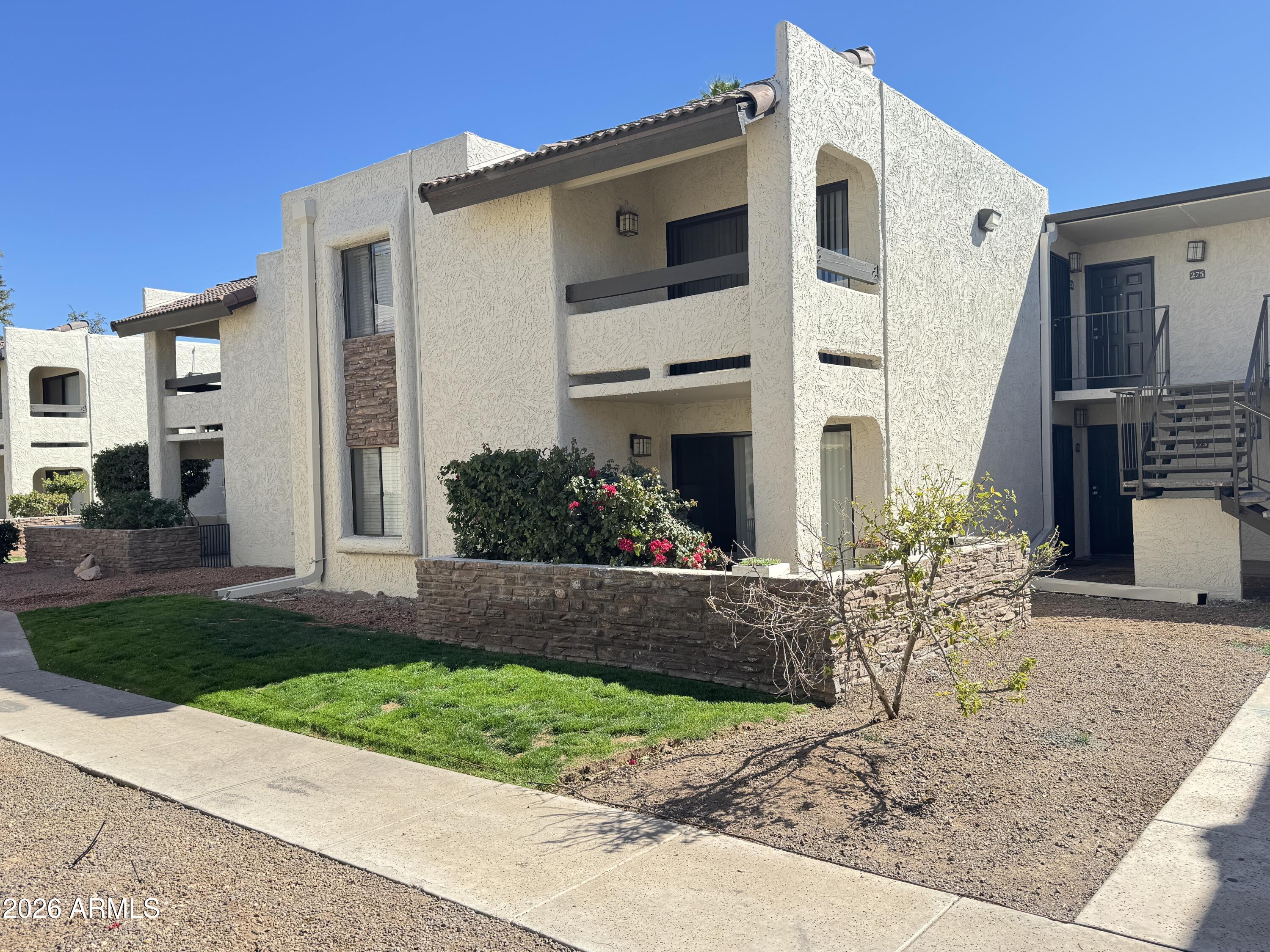 3825 East Camelback Road, Unit 276 Phoenix, AZ 85018 - Photo 12 of 12 a front view of a house with garden