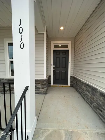 a view of an empty room with stairs