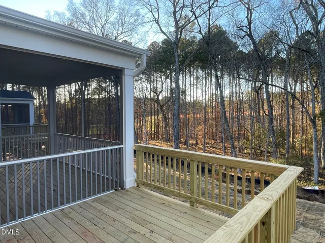 a view of balcony with wooden floor and outdoor space