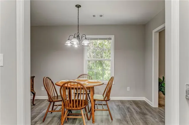 a view of a dining room with furniture window and outside view