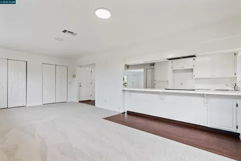 a view of kitchen with wooden floor and window