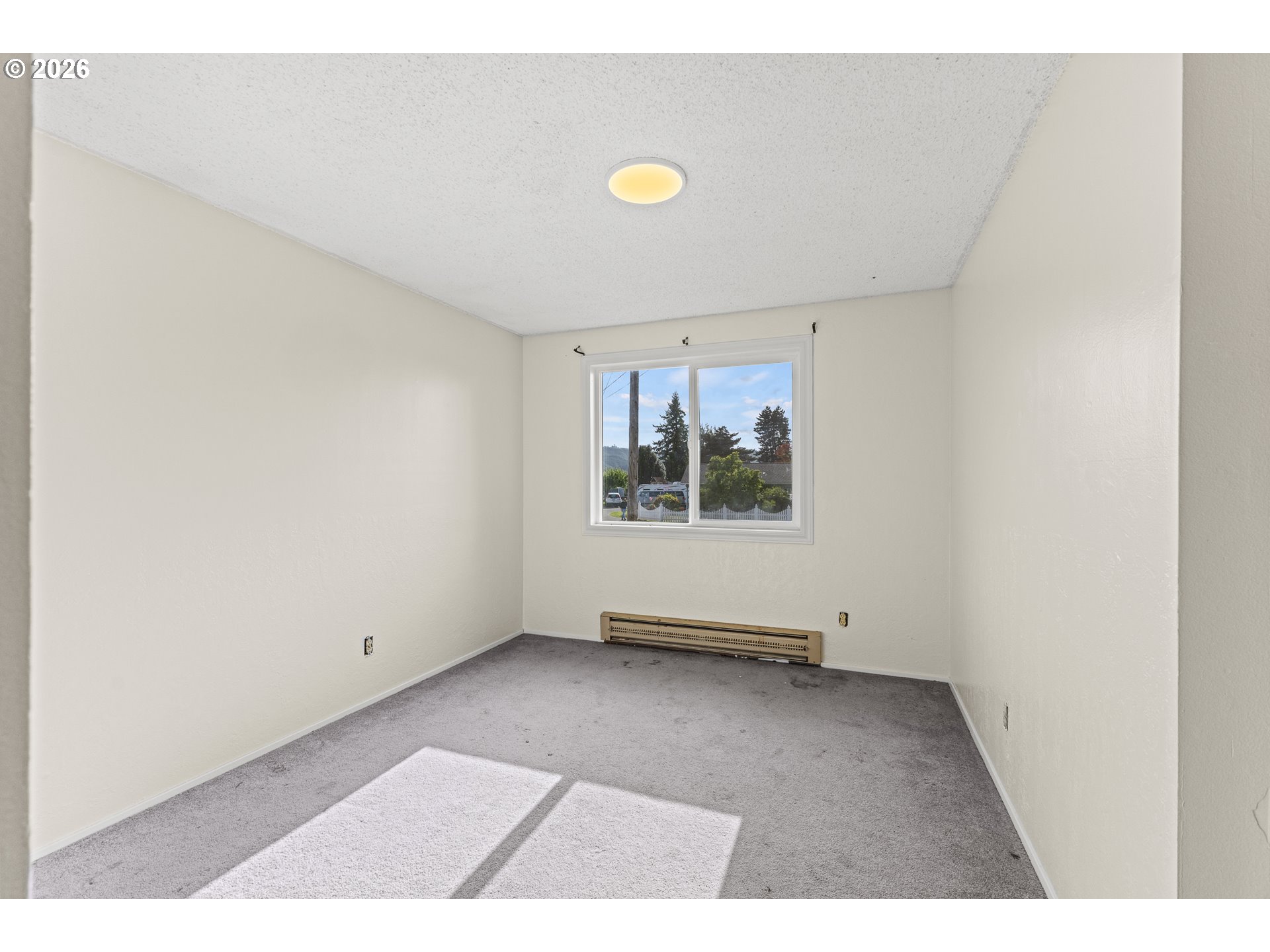 1816 Sunset Court Myrtle Point, OR 97458 - Photo 26 of 42 a view of an empty room with a window