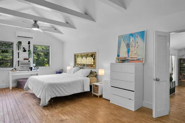 a bedroom with a bed and a table