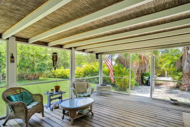 a living room with furniture and a yard