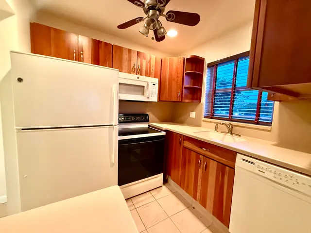 a kitchen with stainless steel appliances a refrigerator and a sink