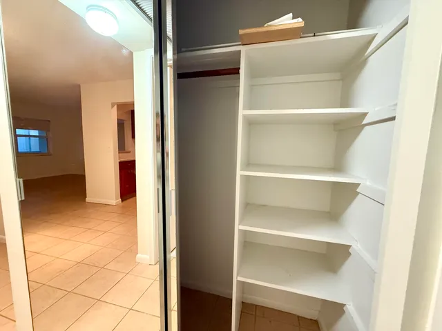 a view of an empty walk in closet