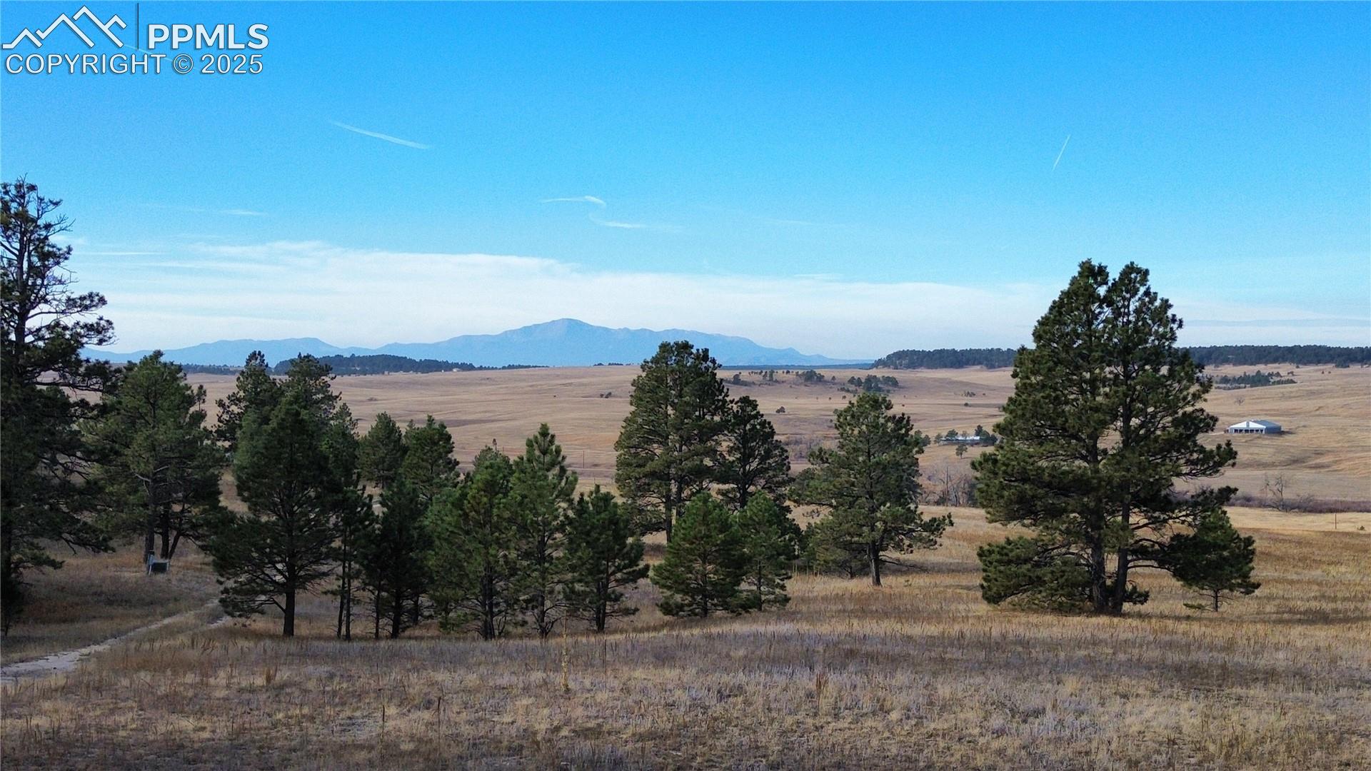 19921 Elbert Road Peyton, CO 80831 - Photo 1 of 7 View of mountain backdrop featuring rural landscape