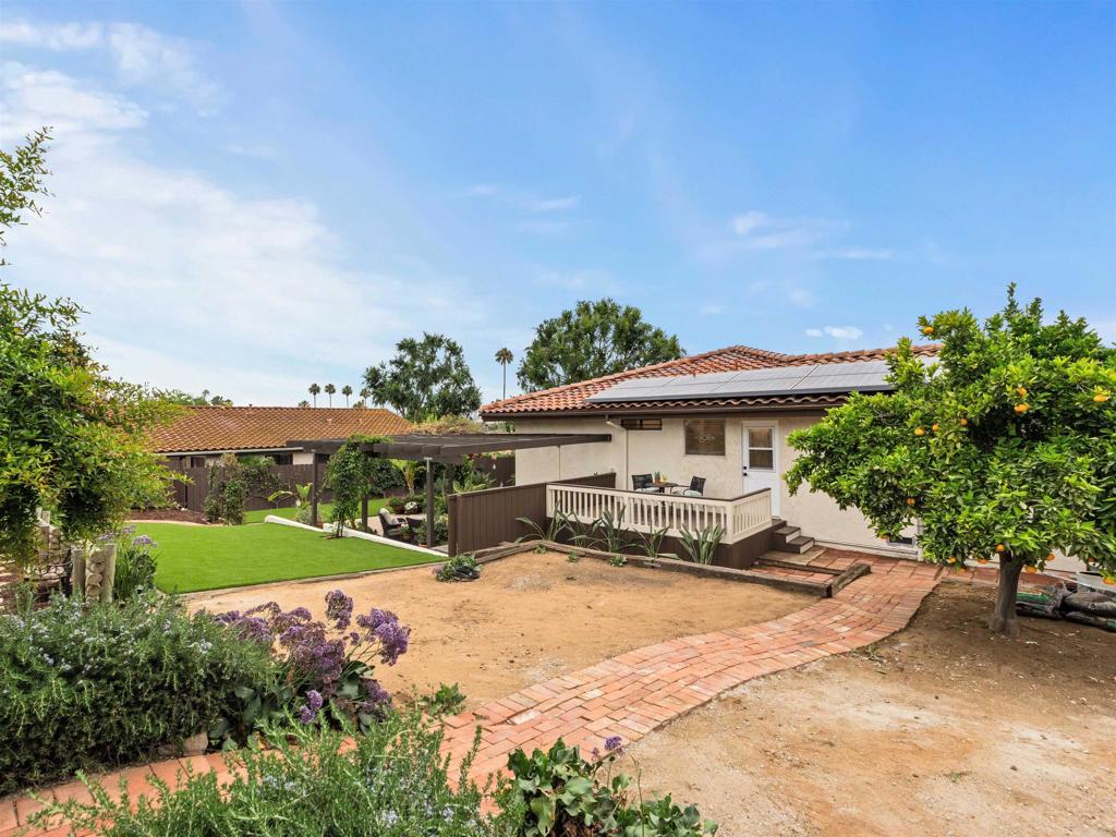 13737 Temple Street Poway, CA 92064 - Photo 35 of 38 a view of a house with backyard and sitting area