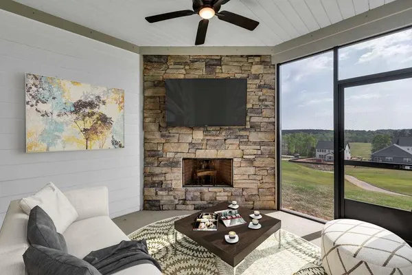 a bathroom with a granite countertop sink a toilet and a mirror