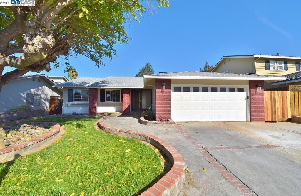 a front view of a house with a garden and porch