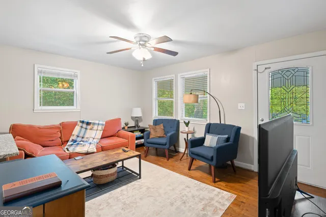 a living room with furniture and a window