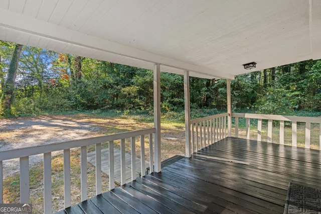 a view of balcony with wooden floor