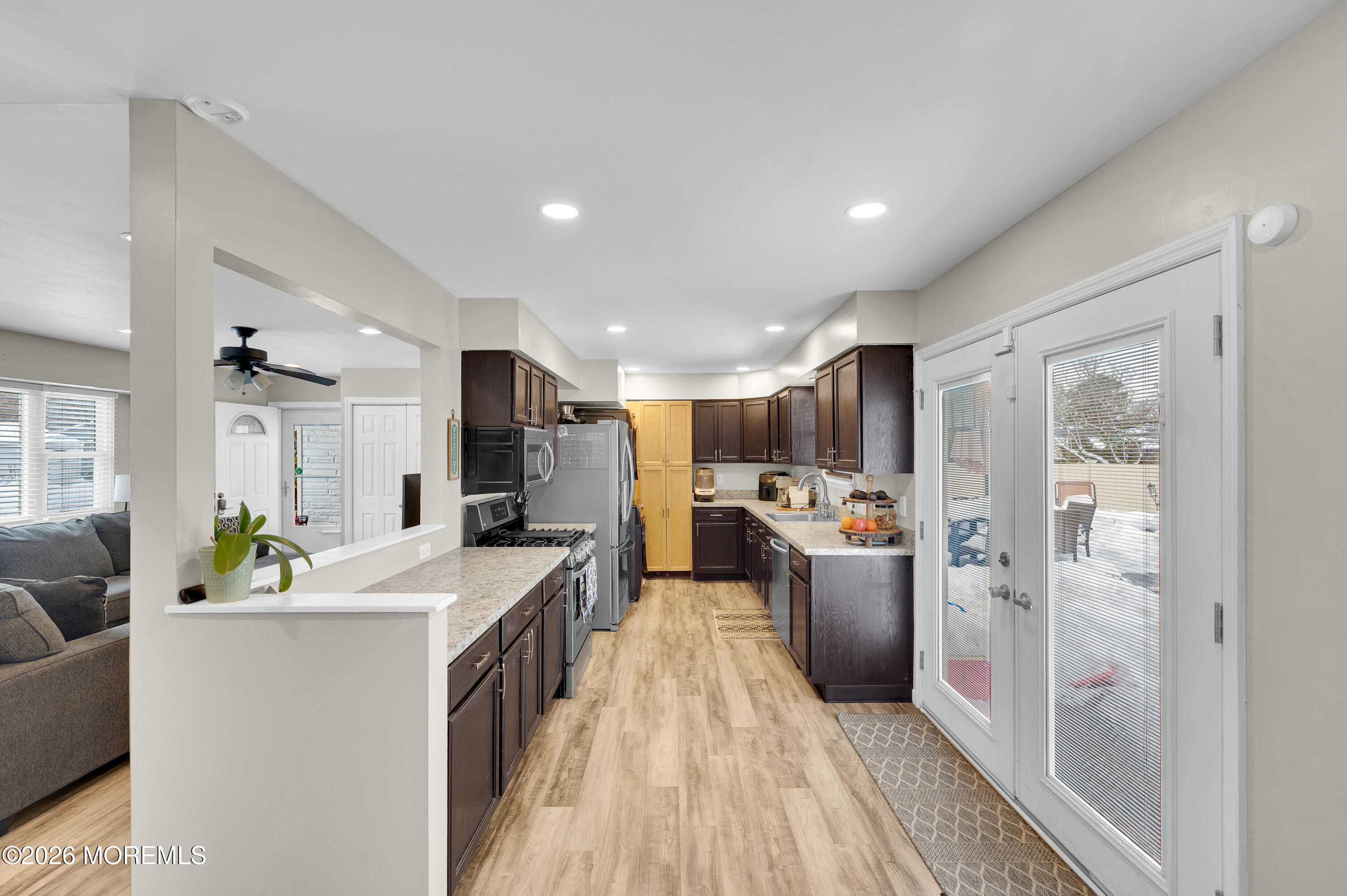 932 Harrison Road Toms River, NJ 08753 - Photo 16 of 30 a large living room with stainless steel appliances