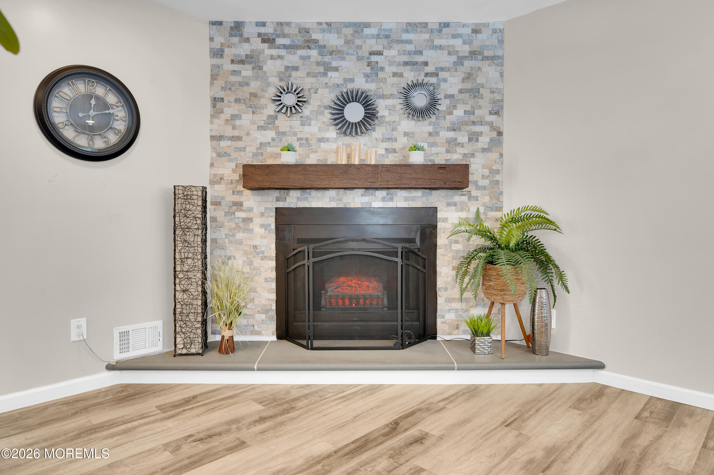 932 Harrison Road Toms River, NJ 08753 - Photo 20 of 30 a view of a livingroom with a fireplace and a chandelier