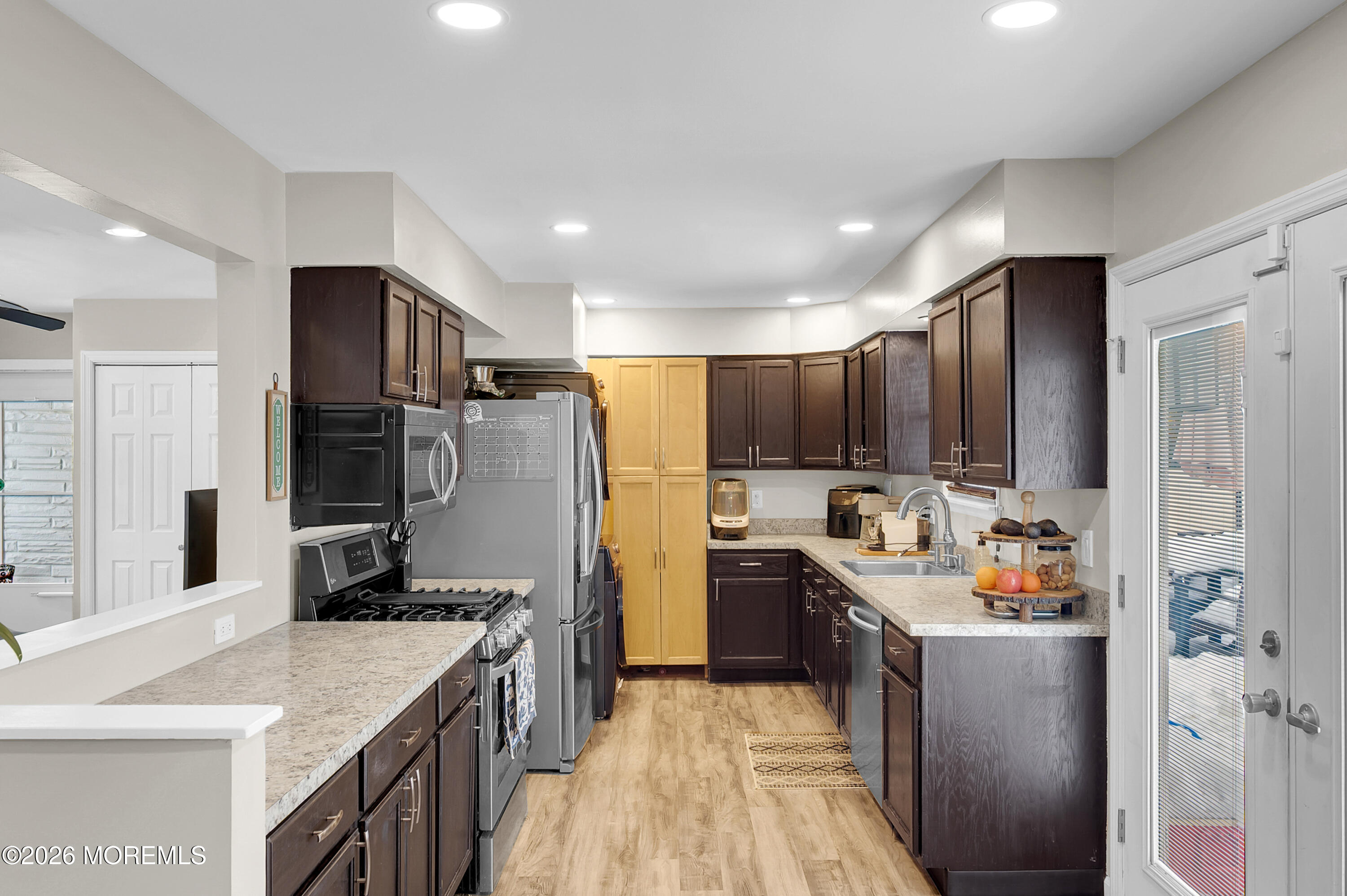 932 Harrison Road Toms River, NJ 08753 - Photo 29 of 30 a kitchen with refrigerator and cabinets