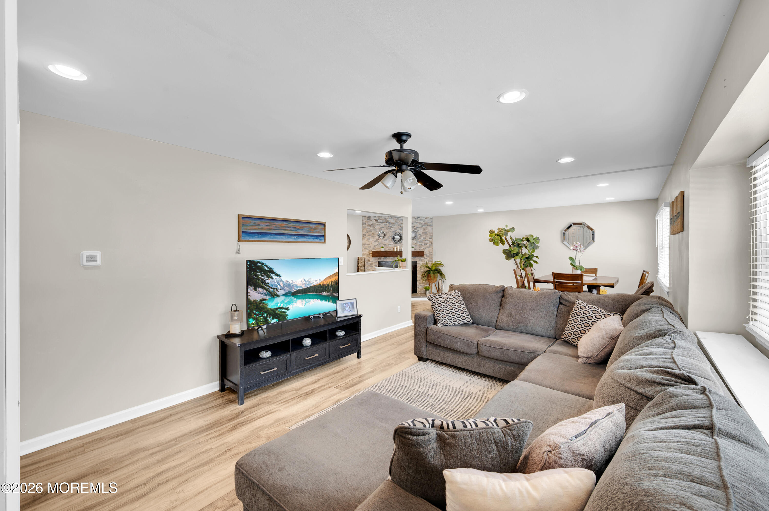 932 Harrison Road Toms River, NJ 08753 - Photo 3 of 30 a living room with furniture and a flat screen tv