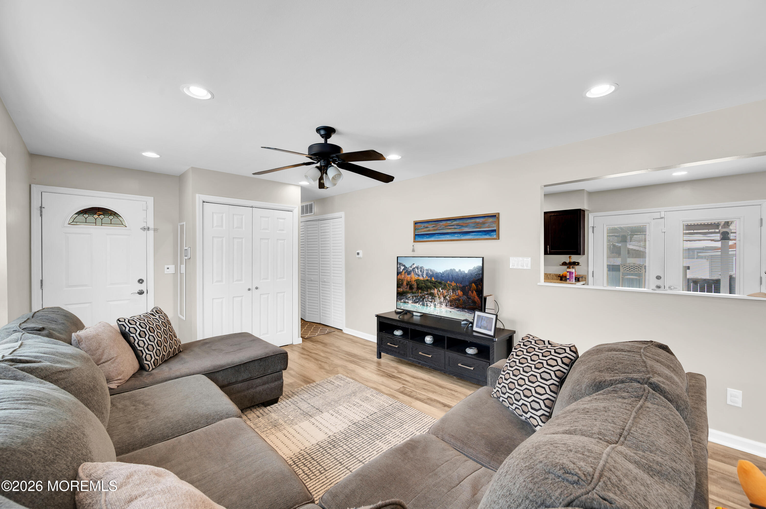 932 Harrison Road Toms River, NJ 08753 - Photo 4 of 30 a living room with furniture and a flat screen tv