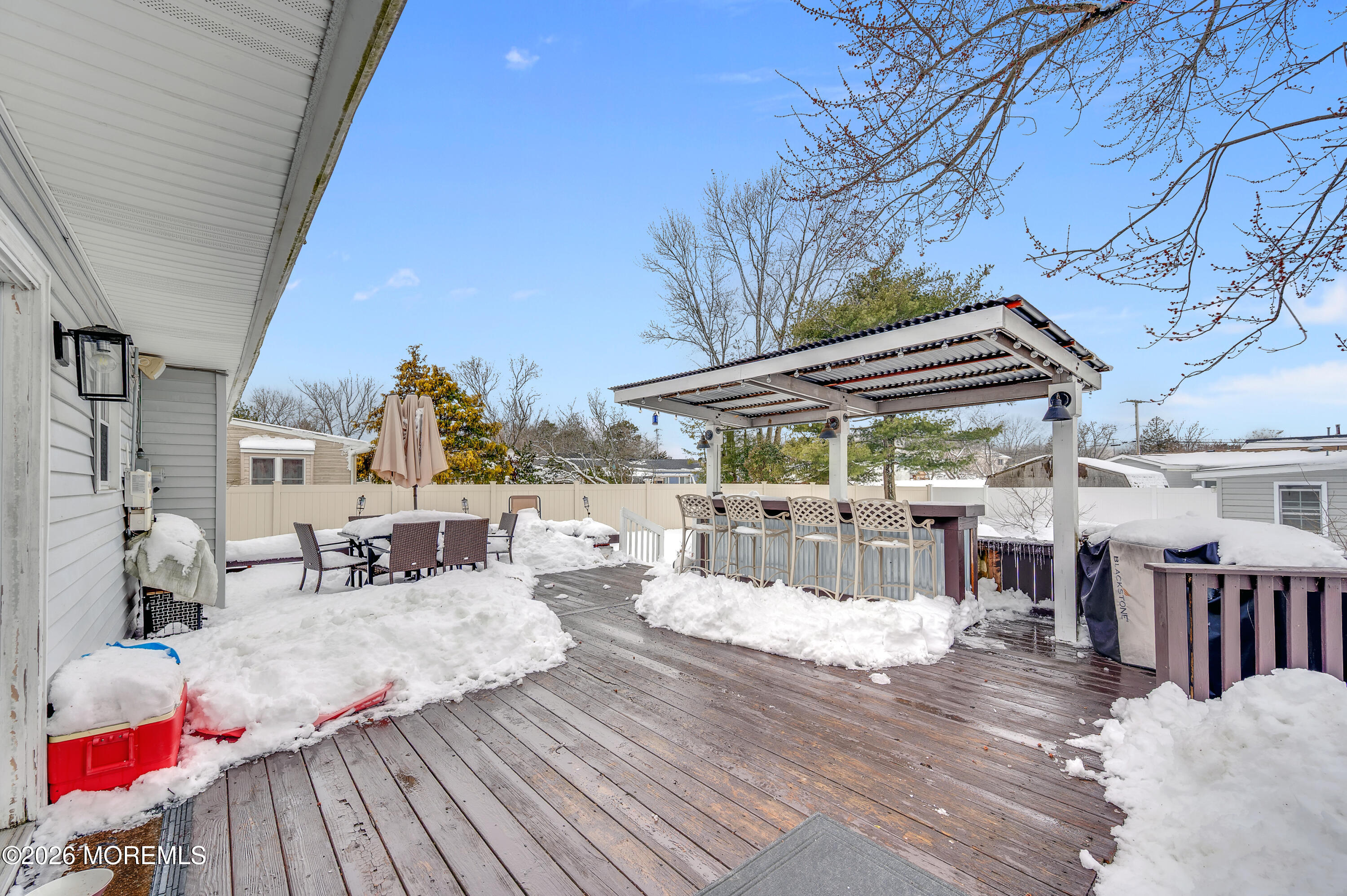 932 Harrison Road Toms River, NJ 08753 - Photo 8 of 30 a view of a patio with a table and chairs