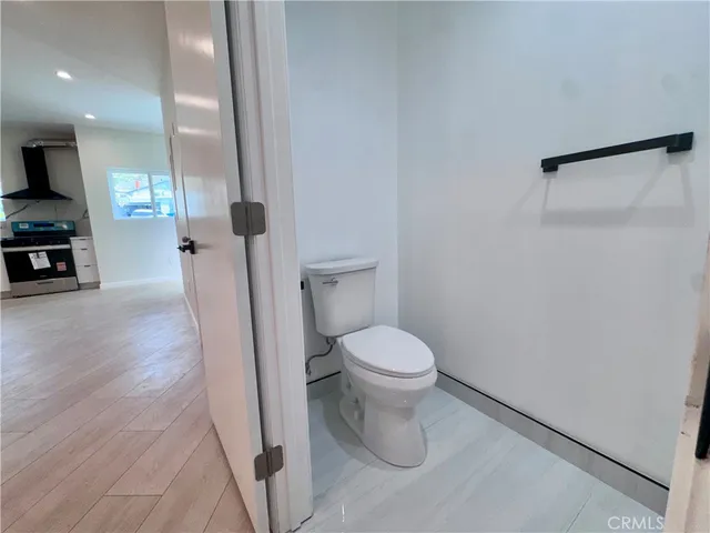 a white toilet sitting next to a bathroom sink
