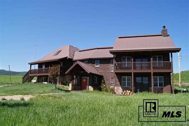 46450 Rcr 46 Steamboat Springs, Unit LONESOME EAGLE RANCH Steamboat Springs, CO 80487 - Photo 1 of 17 a view of a house with a big yard and potted plants